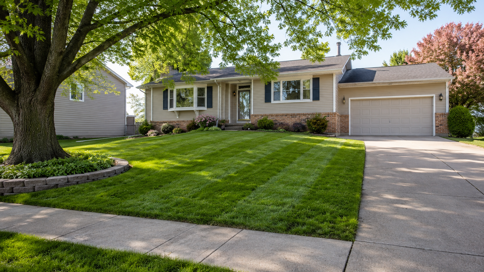 Freshly mowed lawn with clean stripes and edging at a Topeka-style suburban home